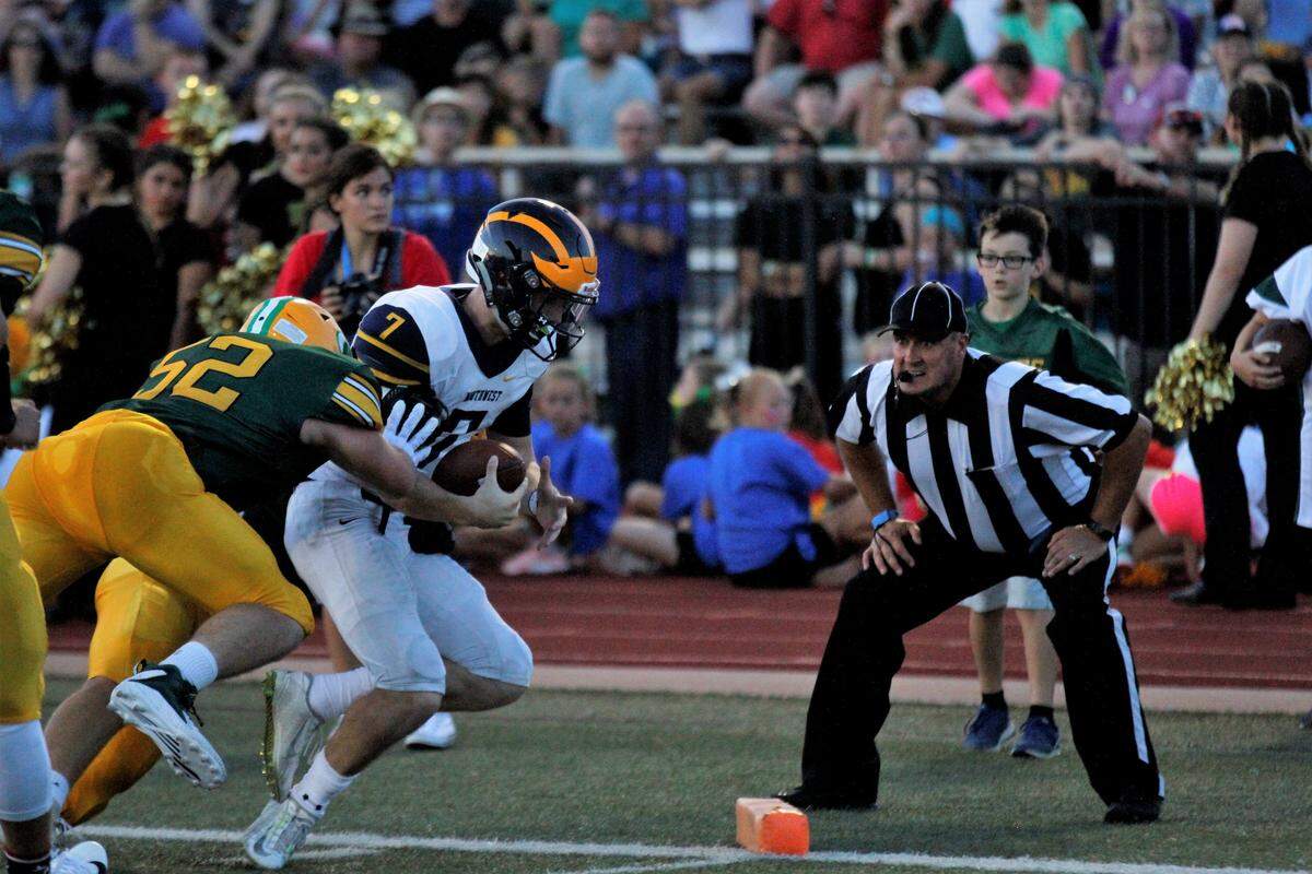 Wichita Northwest junior quarterback Reagan Jones goes for the pylon on a rushing touchdown during the Grizzlies 23-22 win over the Golden Eagles on Friday night. (Aug. 31, 2018)