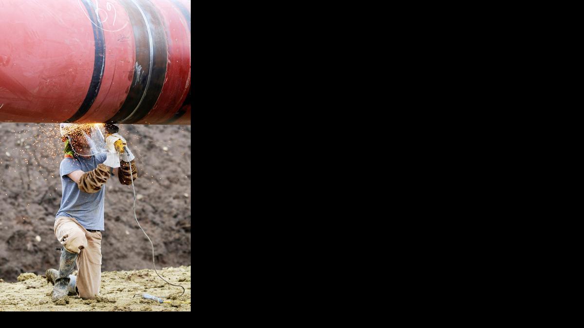 A pipeline worker grinds on a section of the Keystone Pipeline on Thursday, Sept. 16, 2010 near Herington.


