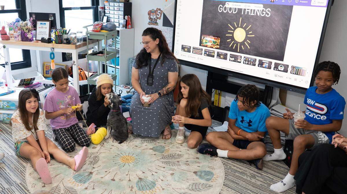Olivia Sumner, center, and her students talk about good things that have happened to them at the start of their school day. (April 2025)