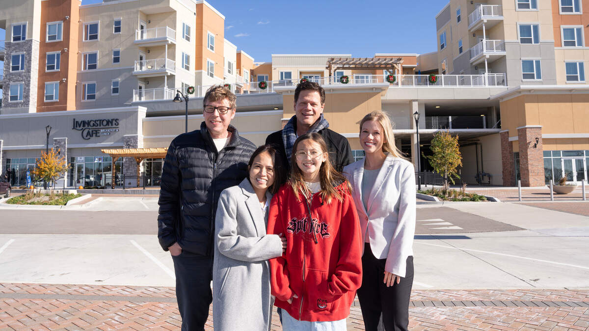 Chadd and Na Atkinson, left, with their daughter, Jasmine, stand in front of Heritage Square where they are opening a sister business to their Urban Nails in Wichita. This one will include booth rentals for aesthetic services as well. Also pictured are dentists Aaron Huslig and Kelsie Diskin, who are moving their of Flint Hills Dental Group to the development.