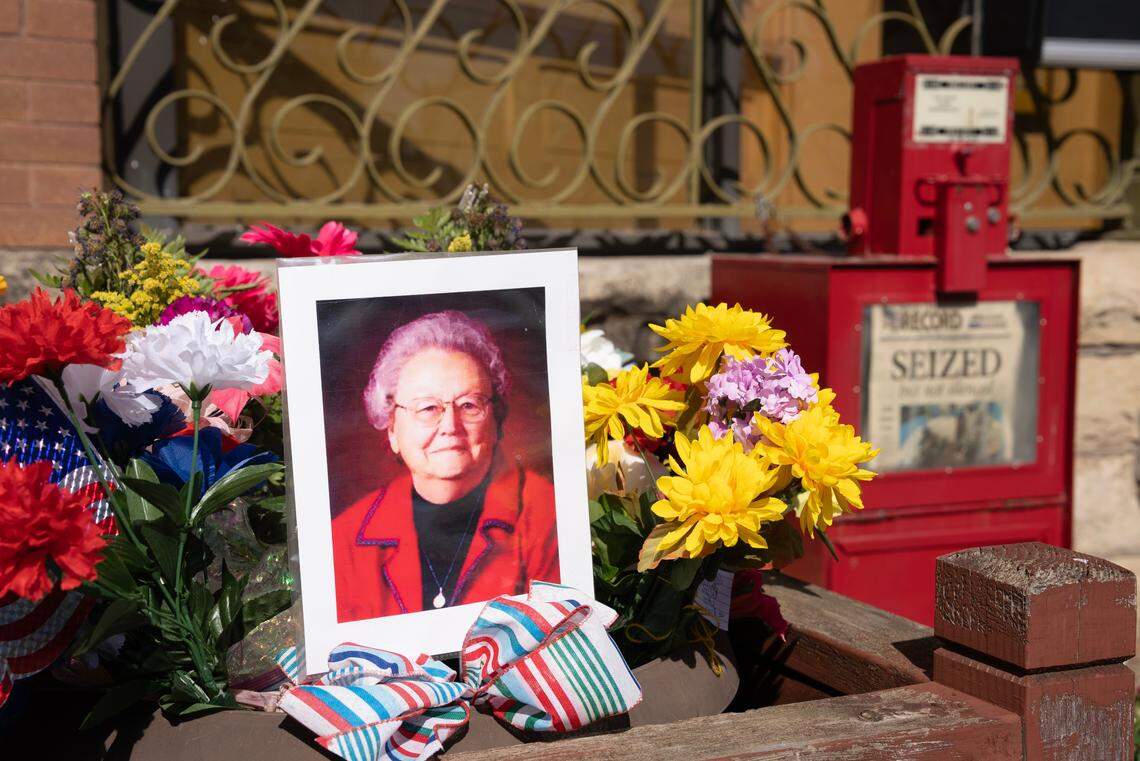 A makeshift shrine is set up in front of the Marion County Record in Marion. The funeral for the newspaper’s co-owner, Joan Meyer, was Saturday, a week after she died following a police raid at her house and the paper.