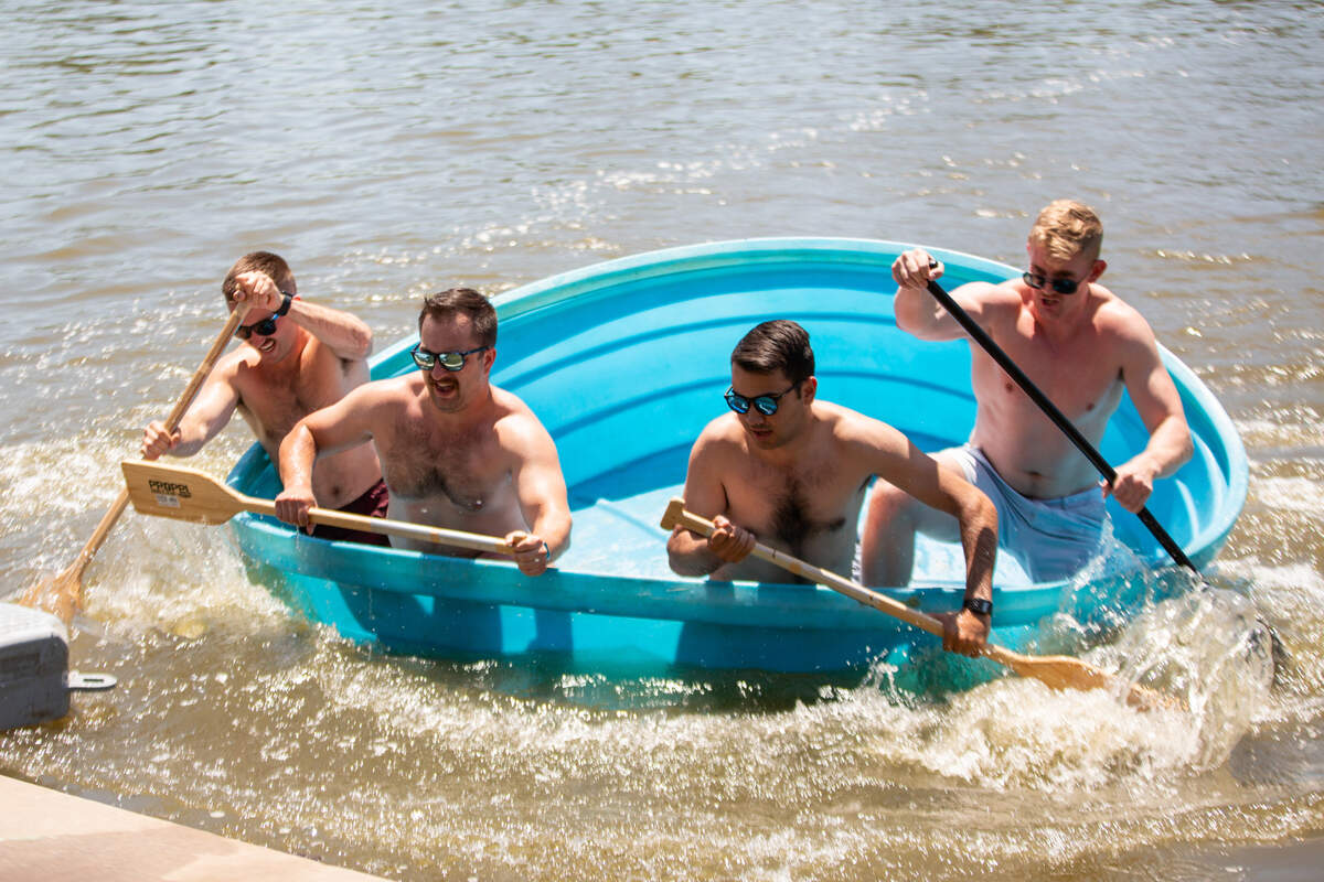 Participants in the cowboy bathtub races close the final gap in their race Saturday. The competition took place on the Arkansas River near Delano.