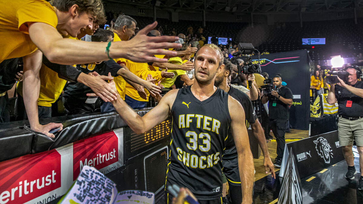 The AfterShocks Conner Frankamp gets congratulated by the fans after beating the Gutter Cat Gang at Koch Arena Wednesday during the TBT Tournament.