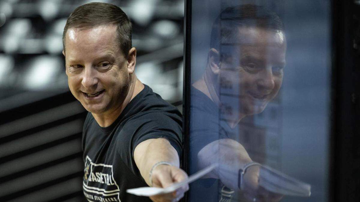 Wichita State men’s basketball coach Paul Mills reviews analytics with his team before a practice at Koch Arena.