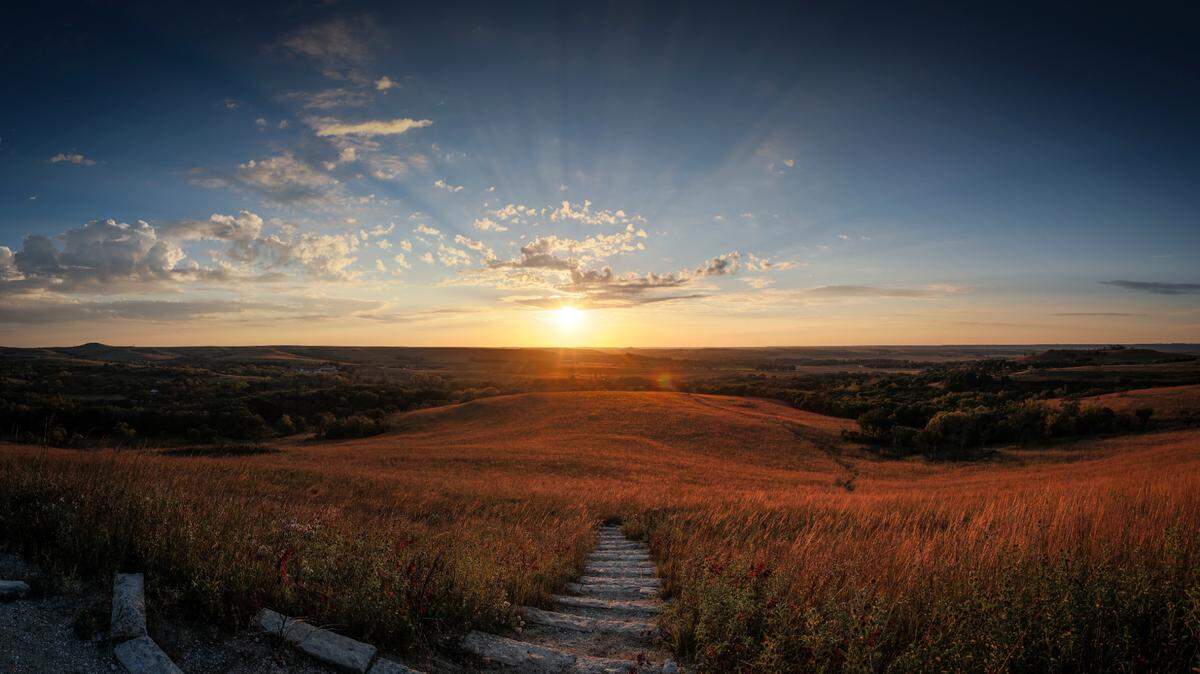 A setting sun can be seen from atop a hill at the Konza Prairie near Manhattan.