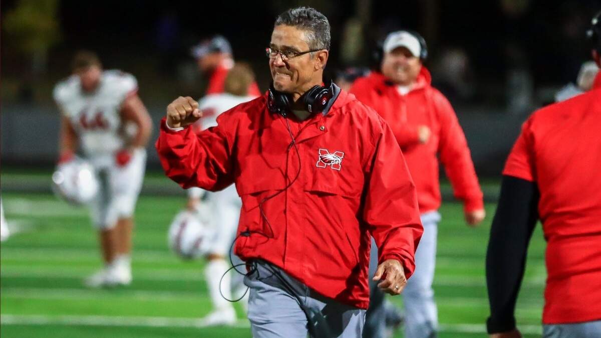 Maize coach Gary Guzman celebrates during the Eagles’ 52-51 win at Derby on Friday. The win vaulted Maize to No. 1 in the latest Class 5A rankings.