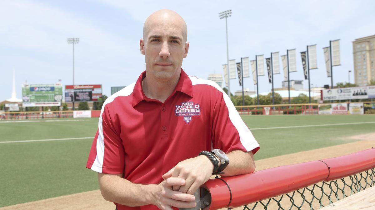 Kevin Jenks stands on the field at Lawrence-Dumont Stadium. Jenks is the NBC World Series tournament director. (July 2, 2014)