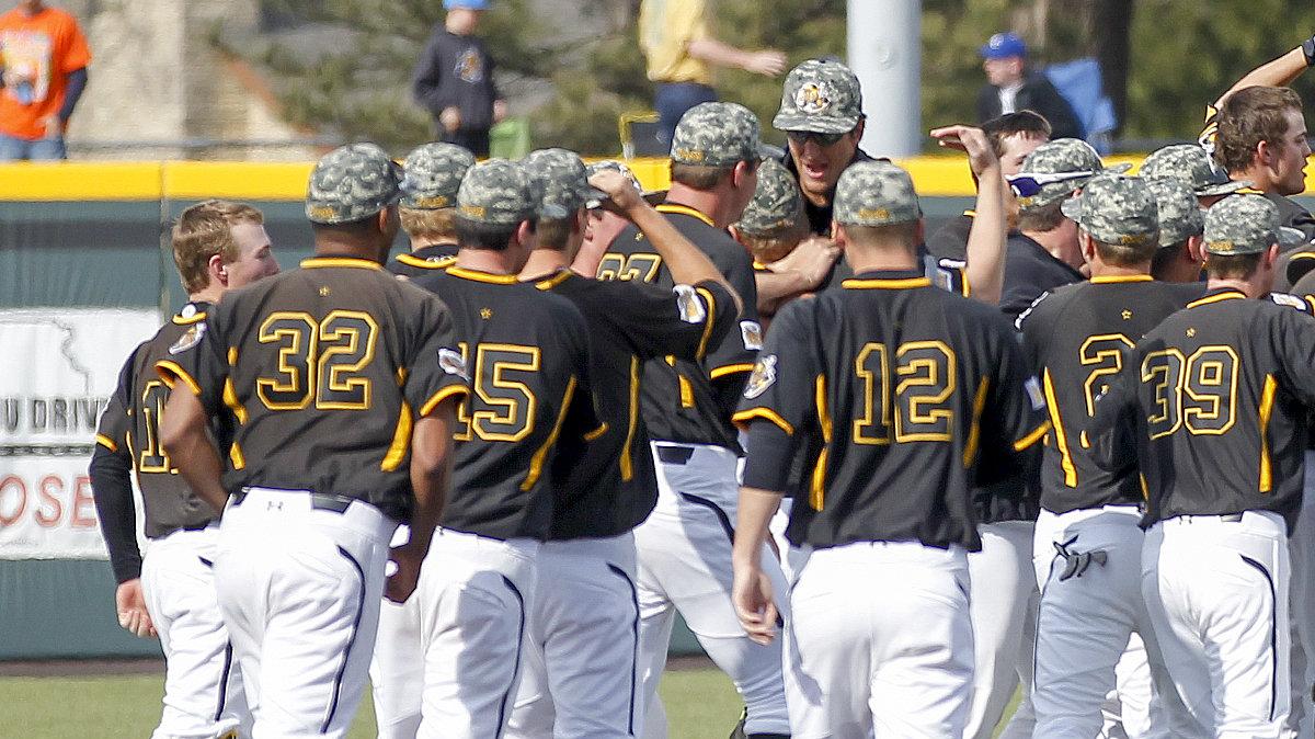 The Wichita State baseball team rushes the field to congratulate Tanner Dearman whose single up the middle scored Joe Haddox to beat Cal State Fullerton 3-2 in the bottom of the 9th inning at Eck Stadium Saturday. (March 29, 2014) 