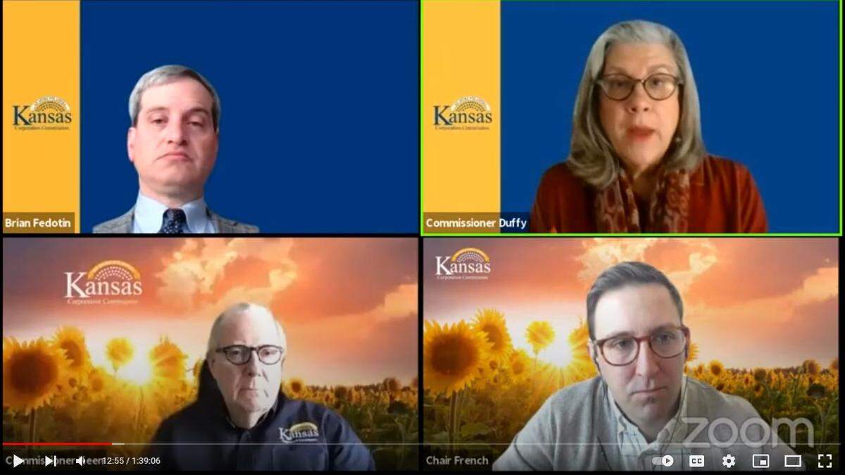 KCC attorney Brian Fedotin, upper left, and commissioners Dwight Keen, lower left, and Andrew French, lower right, listen to Commissioner Susan Duffy, who was bluntly critical of the role played by international hedge fund Elliott Management in running Evergy, Kansas’ dominant power company.