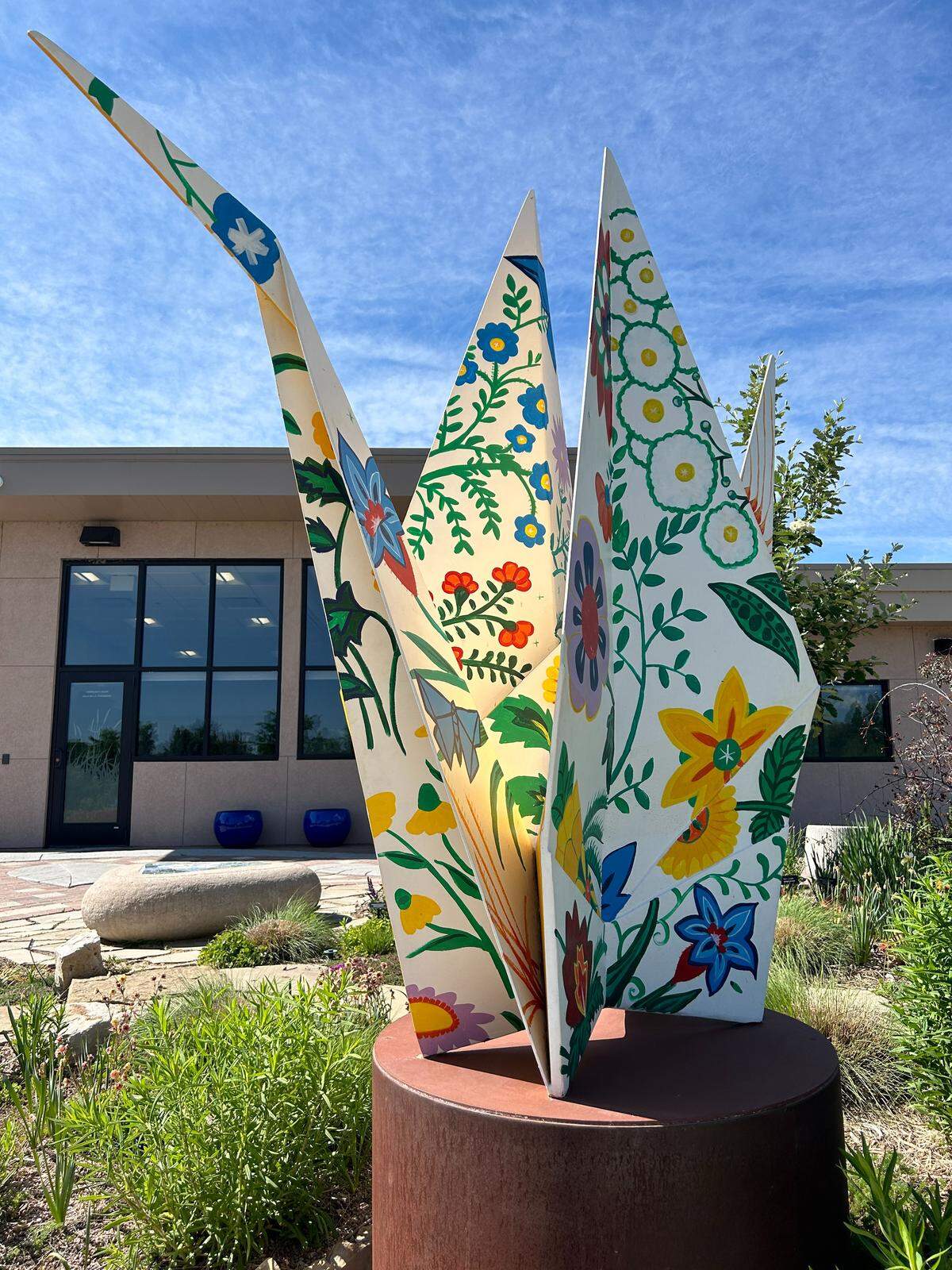 Origami in the Garden is the latest traveling exhibit at Botanica on display through New Mexico-based artist Kevin Box translates and transforms small paper origami creations made by the origami artists he collaborates with into much larger-scale metal sculptures.