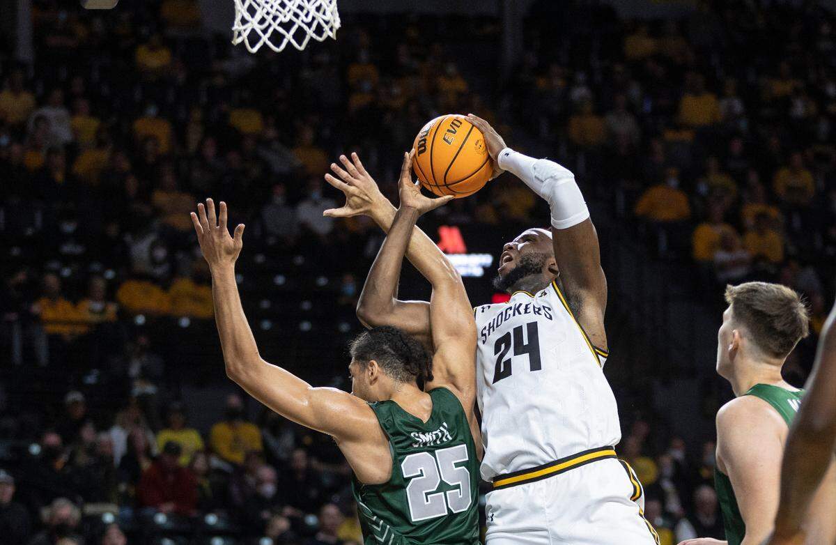 Wichita State’s Morris Udeze is fouled by Missouri Southern’s RJ Smith during the first half of their exhibition game at Koch Arena on Monday night.