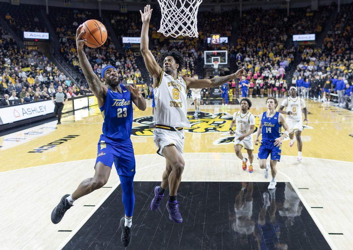 Dillon Battie blocks the shot of Tulsa’s David Green during the first half at Koch Arena on Saturday night.