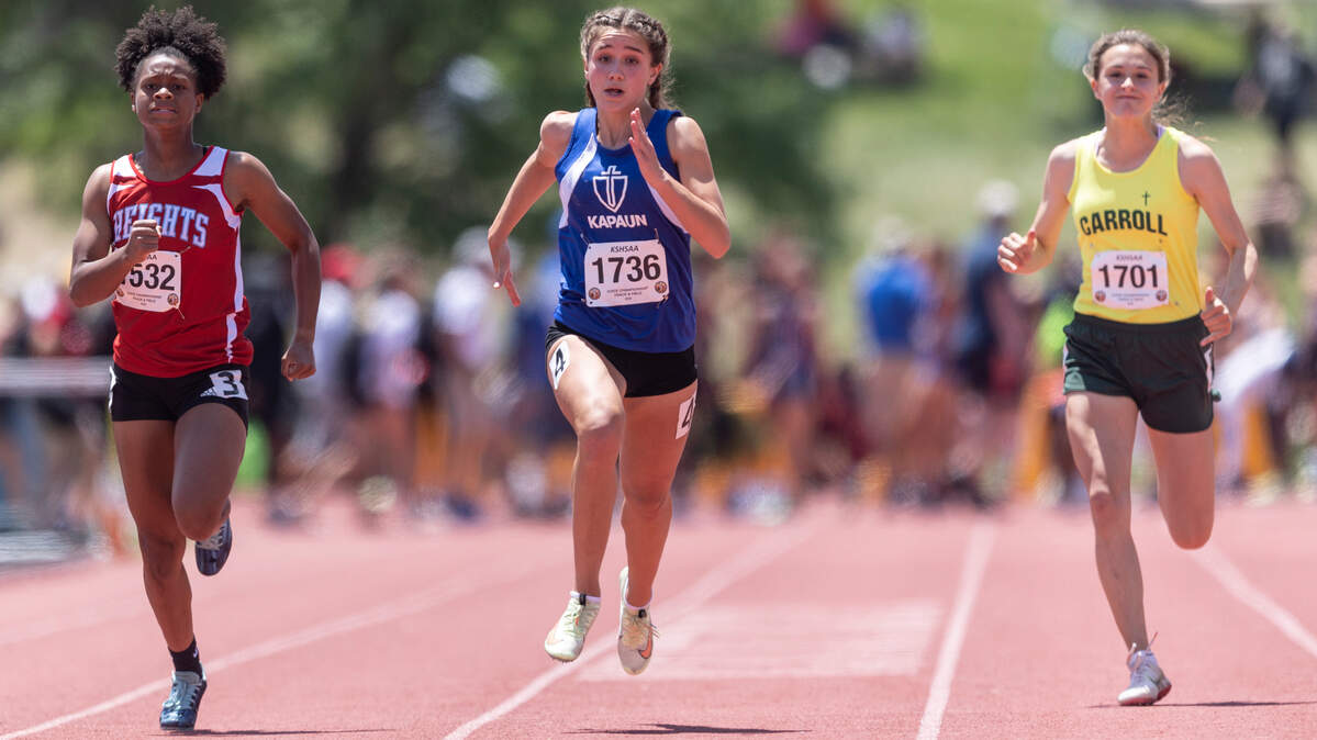 Kapaun’s Lillian Harris wins the 5A 100m dash on Saturday at the Kansas State High School Track and Field Championships at Cessna Stadium.