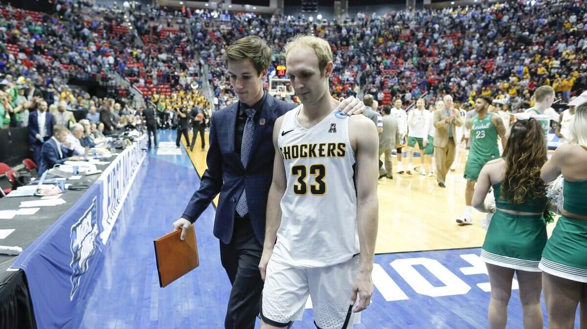 Conner Frankamp walks off the court with Kellen Marshall after Wichita State lost in the first round of the NCAA Tournament on Friday in San Diego.