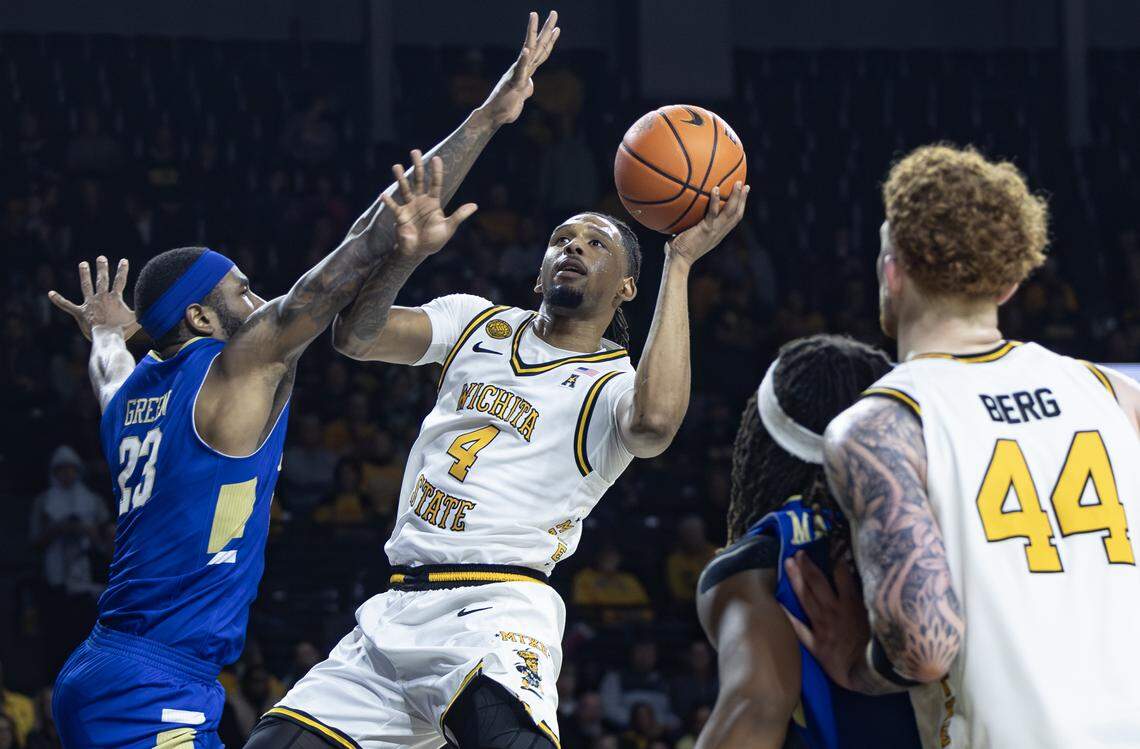 Wichita State’s TJ Williams goes up for a shot against Tulsa’s David Green during the first half at Koch Arena on Saturday night.