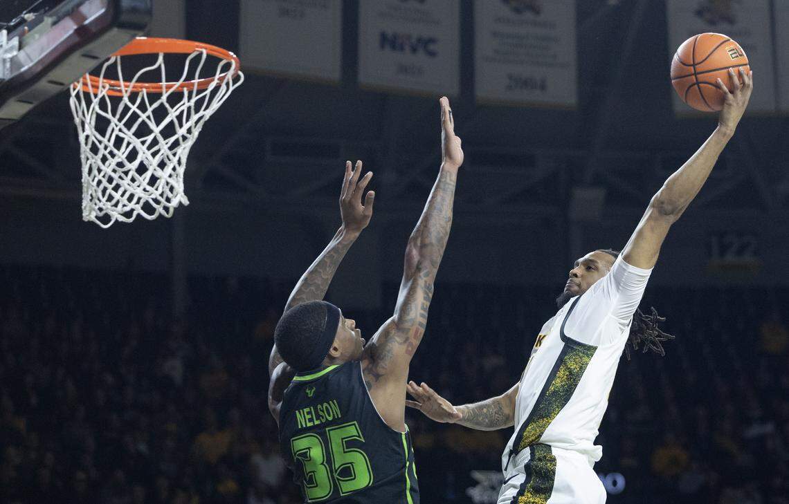 Wichita State’s TJ Williams goes up for a shot over South Florida’s Izaiyah Nelson during the first half at Koch Arena on Wednesday night.