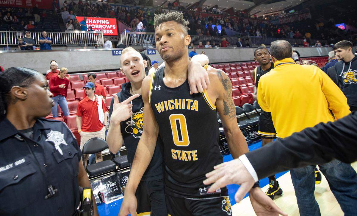 Dexter Dennis walk off the court after scoring 25 points while leading a complete a dramatic comeback after being down 24 to SMU in the second half. Wichita State won 66-62.