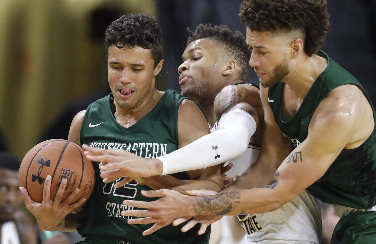 Wichita State’s Dexter Dennis gets fouled in the first half while trying to defend Northeastern State’s Caleb Smith during the first half of their exhibition game at Koch Arena.