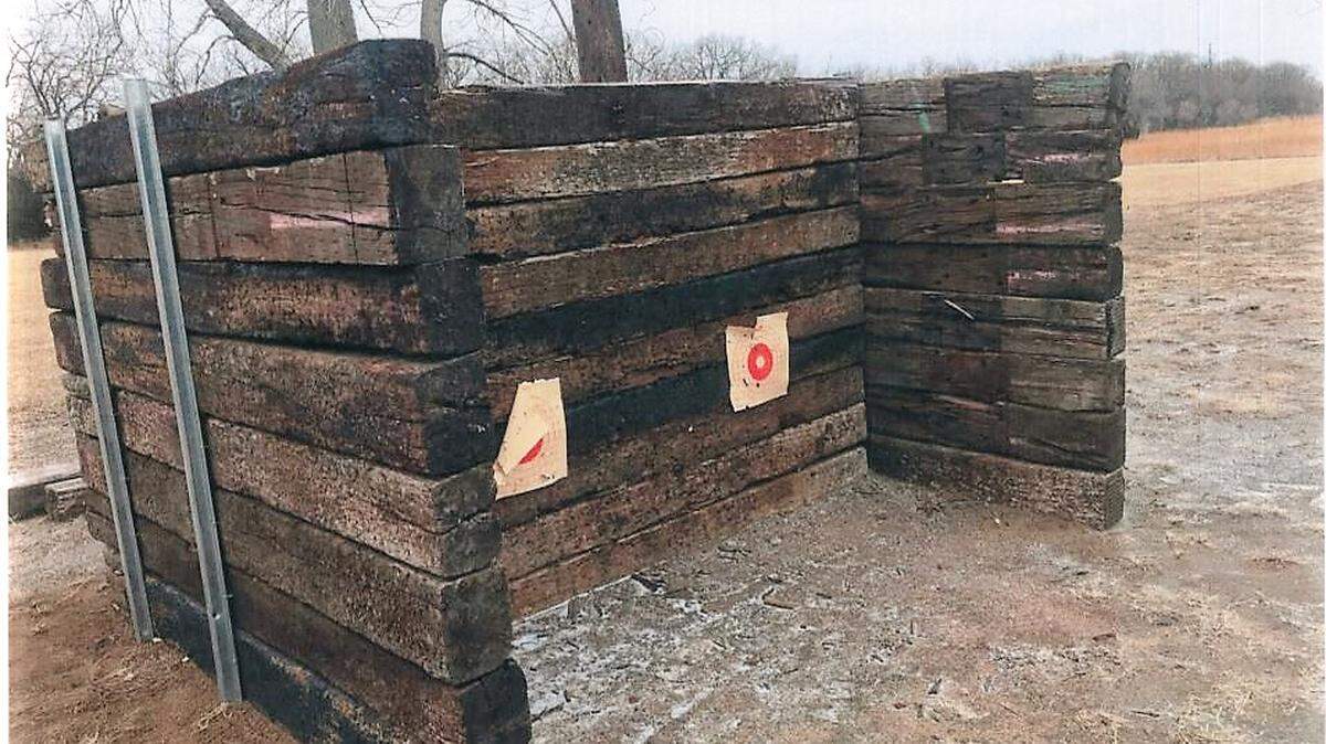 Bill Angstadt gave county commissioners pictures of his bullet backstop on Thursday. Commissioner Jim Howell said others in the neighborhood are far less substantial, leading to stray shots and ricochets flying through a nearby tract of homes.