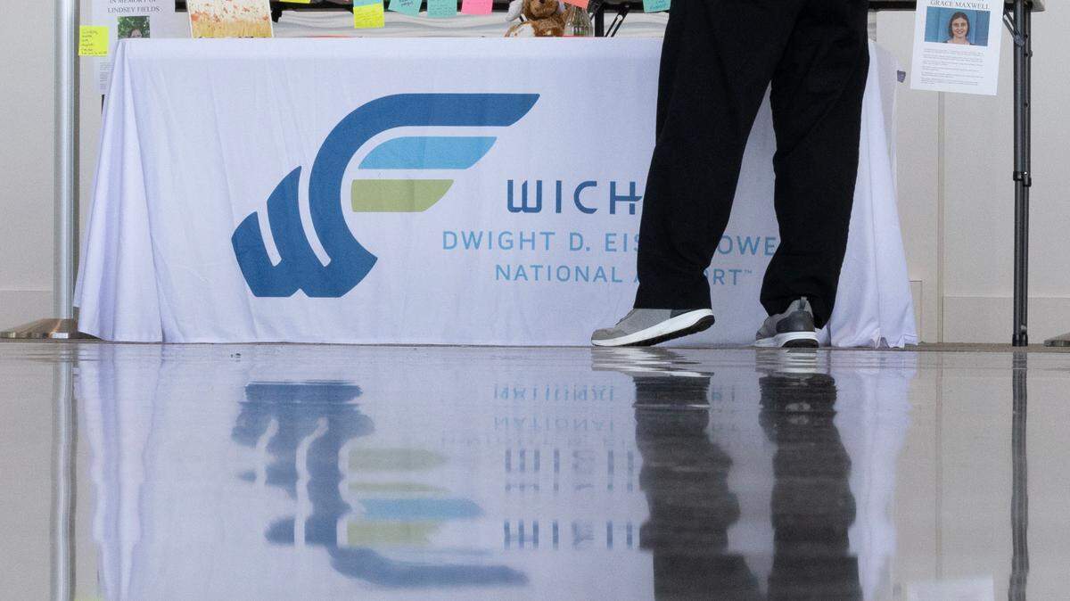 A table at Wichita’s Eisenhower Airport has been set up for people to leave messages of condolence for the crash victims.