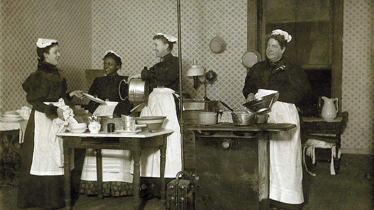 A early group of Thursday Afternoon Cooking Club members getting ready to teach a cooking class