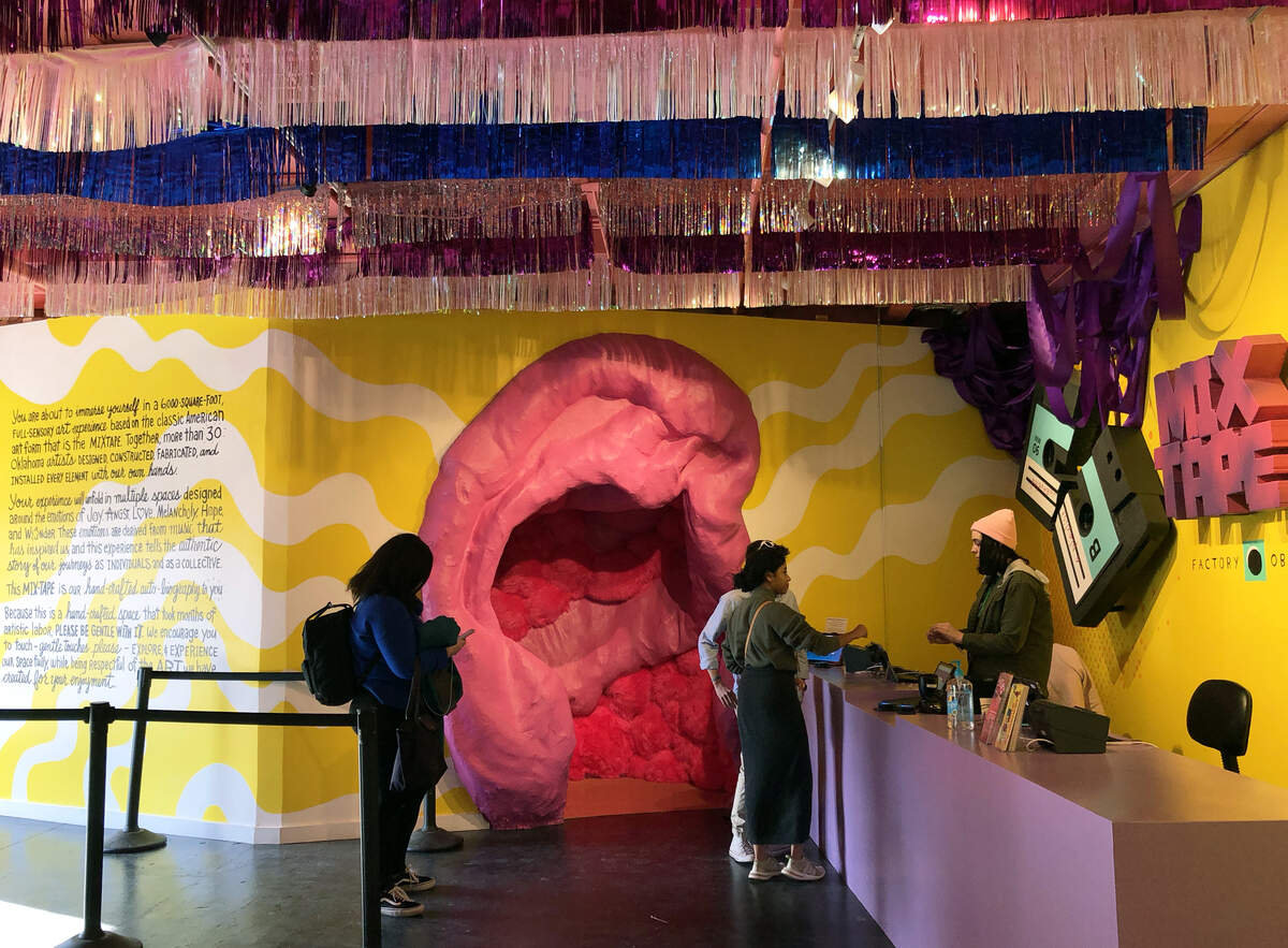 Visitors enter the Mix-Tape experience through a giant ear in the lobby.