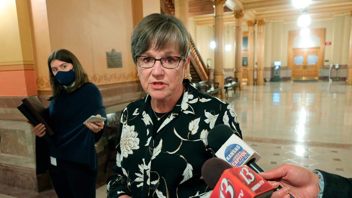 Kansas Gov. Laura Kelly speaks with reporters April 16 after vetoing a plan from Republican legislators for cutting state income taxes. Lawmakers overrode her veto Monday,