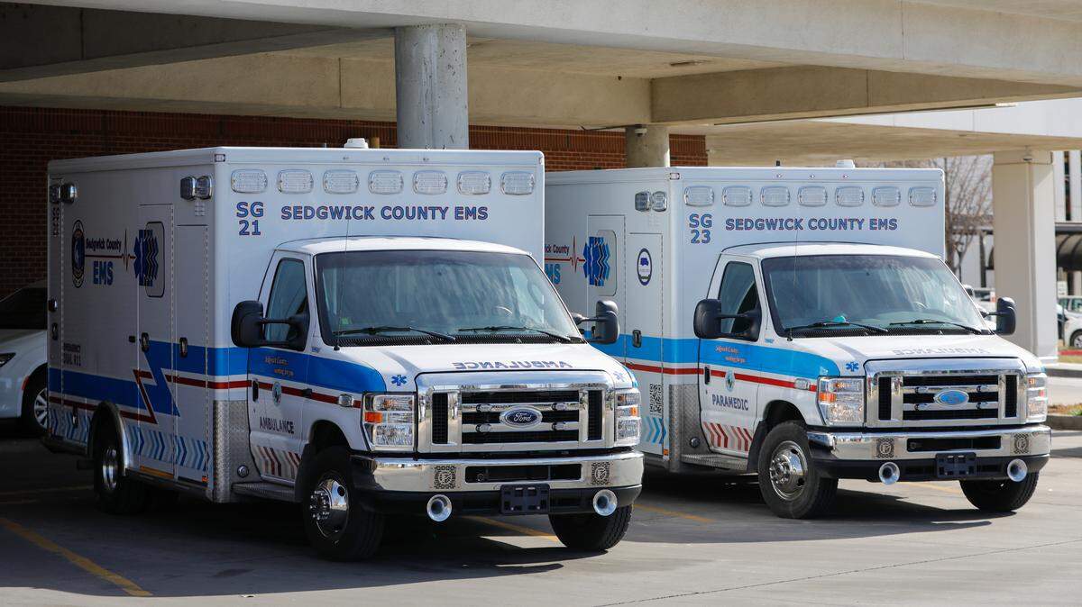 Two Sedgwick County EMS ambulances parked outside of St. Francis.