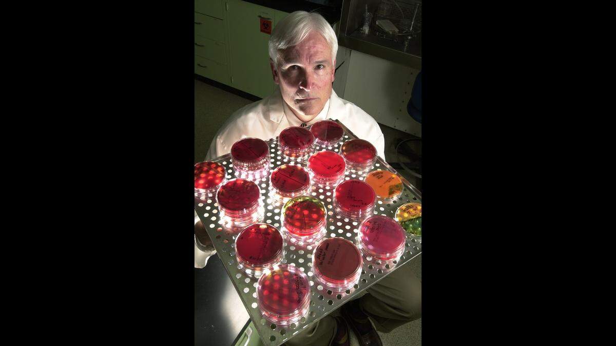 Jerry Jaax holds biological samples at the Kansas State University veterinarian school in Manhattan in this 2001 photo.