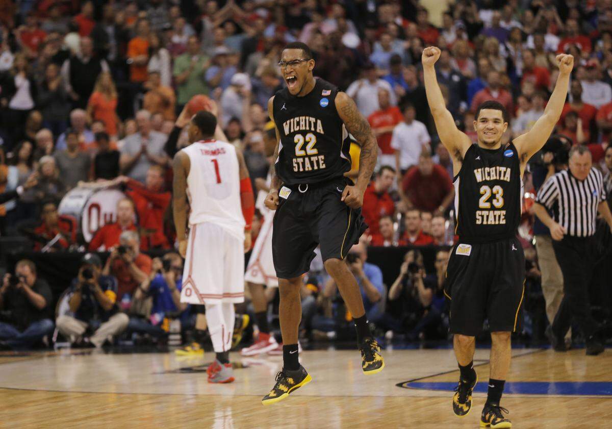 Wichita State Shockers forward Carl Hall (22) and Wichita State Shockers guard Fred Van Vleet (23) celebrate after beating Ohio State in the NCAA Tournament regional final at Staples Center in Los Angeles. The team will advance to the Final Four in Atlanta. (March 30, 2013)