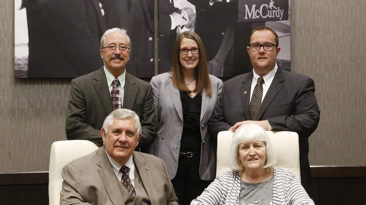 Lonny and Annette McCurdy (front row) along with Rick Brock (left rear) Megan McCurdy Neidens and her brother Braden (right rear). McCurdy Auction is Small Biz awards finalist.