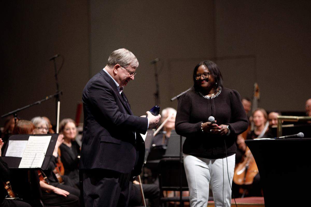 Don Reinhold is pictured with Board Chair Ebony S. Clemons at his final concert with the Wichita Symphony Orchestra in April.
