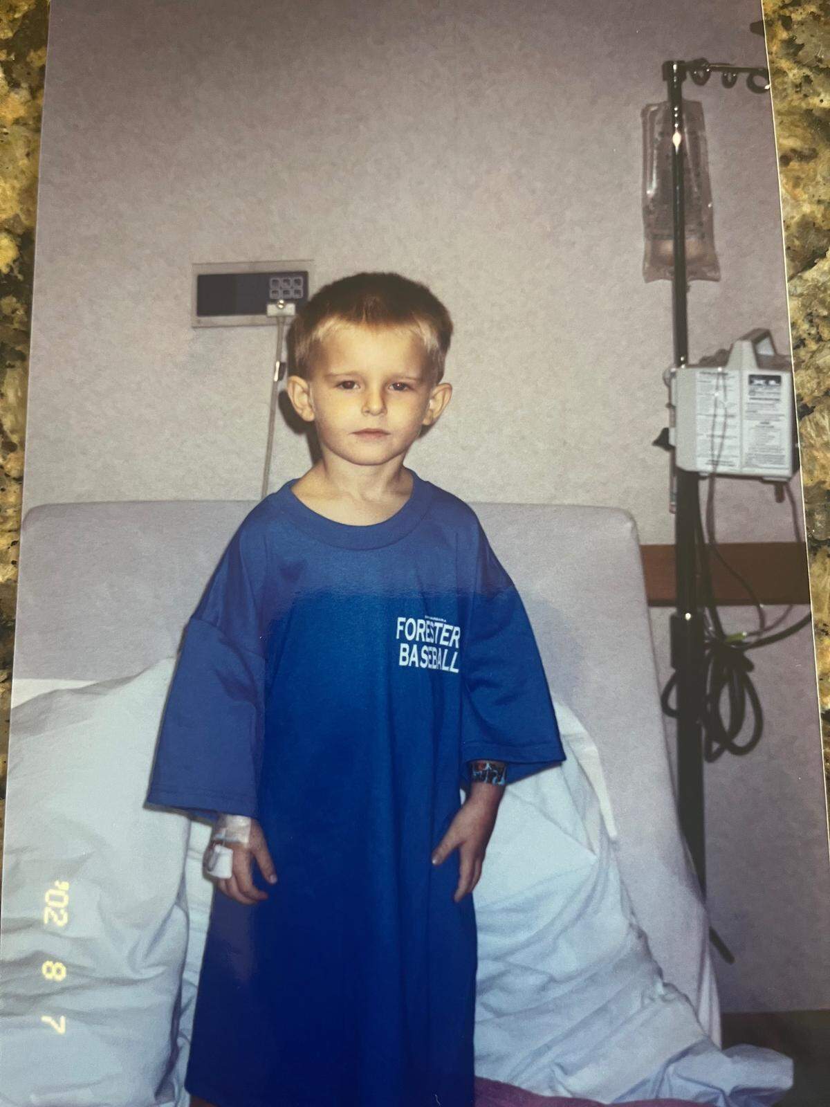 Spencer Olmstead showing off his Santa Barbara Foresters t-shirt when he was 3-years-old and a patient at Wesley Medical Center. The team came and visited him that summer, then later asked him to be their bat boy for the 2003 tournament.
