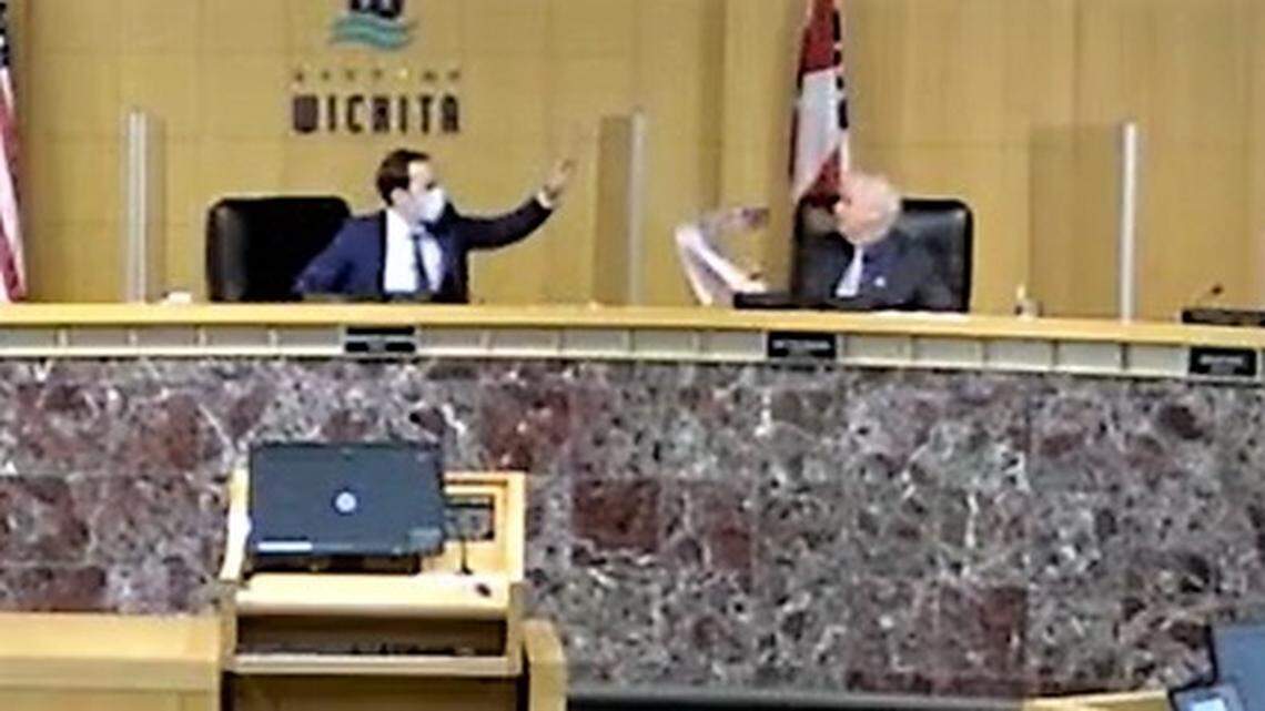 Wichita Mayor Brandon Whipple ends a City Council workshop on ethics by throwing a stack of papers over the COVID barrier at council member Jeff Blubaugh. The papers were a collection of social media memes and posts made by Whipple supporters criticizing various Republican politicians, which Blubaugh had printed out, demanding that Whipple denounce them.