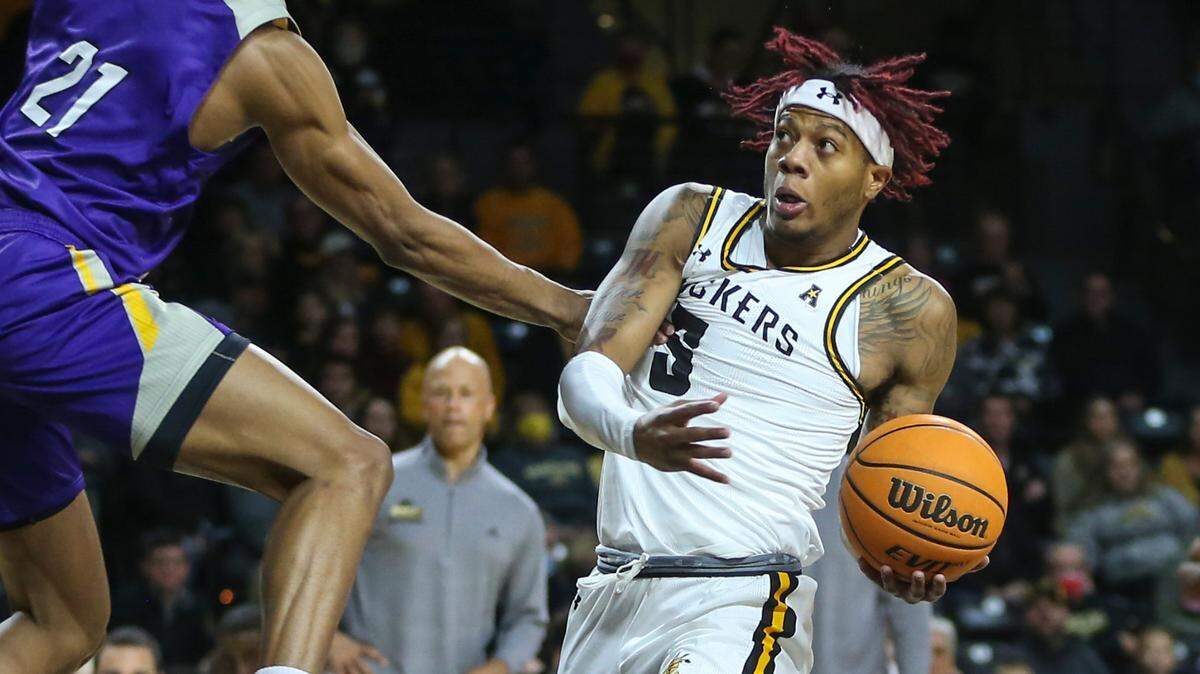 Wichita StateÕs Monzy Jackson is fouled while going to the basket during the first half of their game against Prairie View A&M on Wednesday night at Koch Arena.