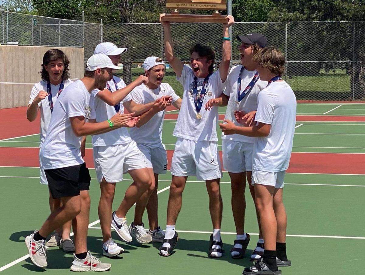 The Maize South boys tennis team celebrates the program’s first team state championship after the Mavericks won the Class 5A team title in Topeka on Saturday.