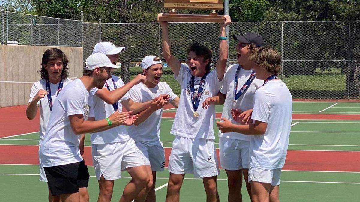 The Maize South boys tennis team celebrates the program’s first team state championship after the Mavericks won the Class 5A team title in Topeka on Saturday.