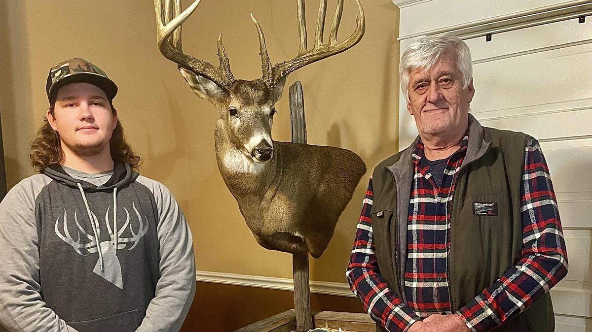 Matthew Daniels surprises his father, Albert Daniels, on Christmas Eve with a replica of his whitetail he shot in 1995 in Franklin County. It is now officially the Kansas record for largest typical buck.