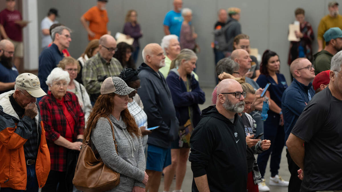 Early voters wait in line at the Sedgwick County Extension Center on Wednesday.