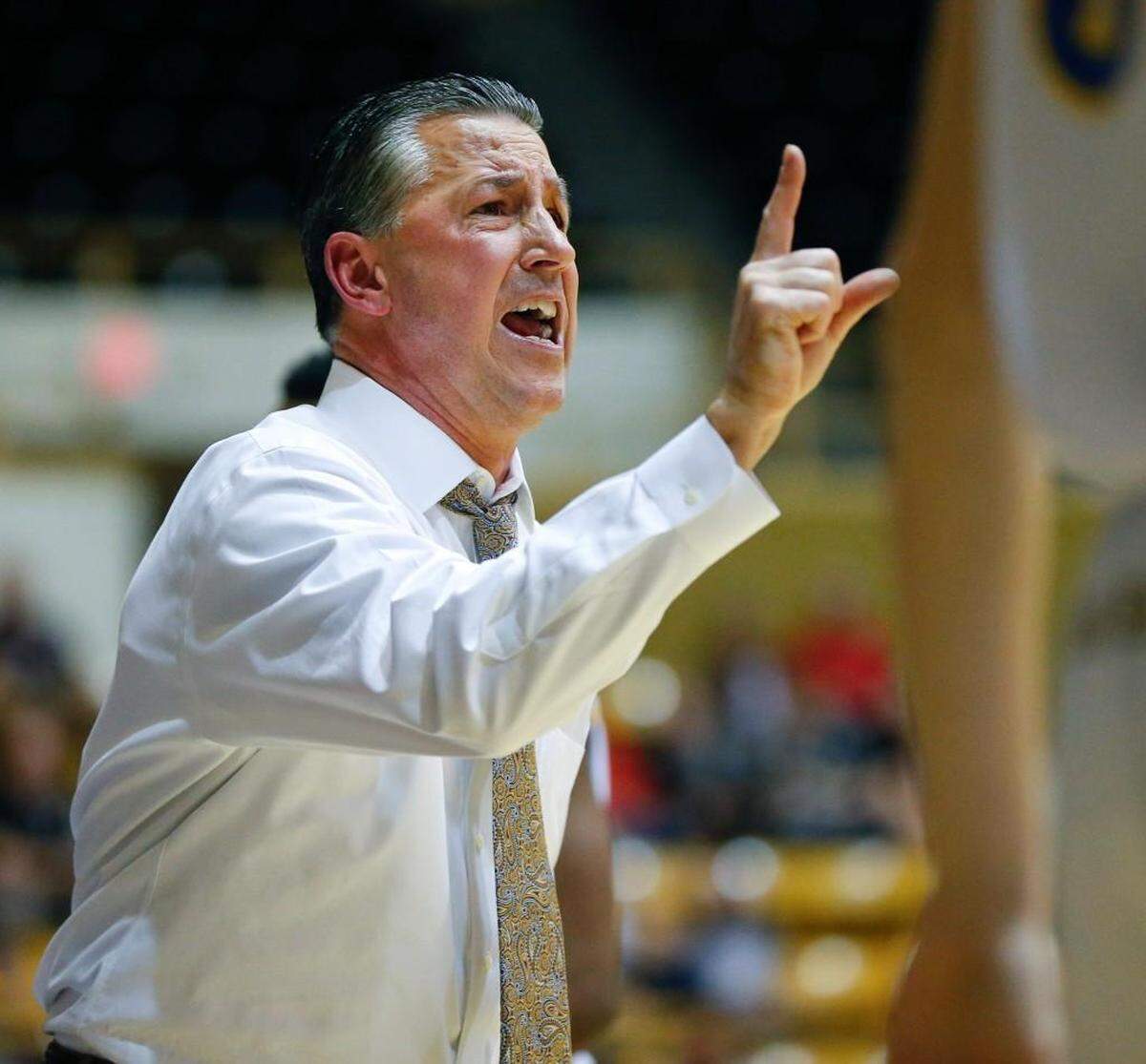 Collegiate coach Mitch Fiegel calls out the play during a state tournament game.