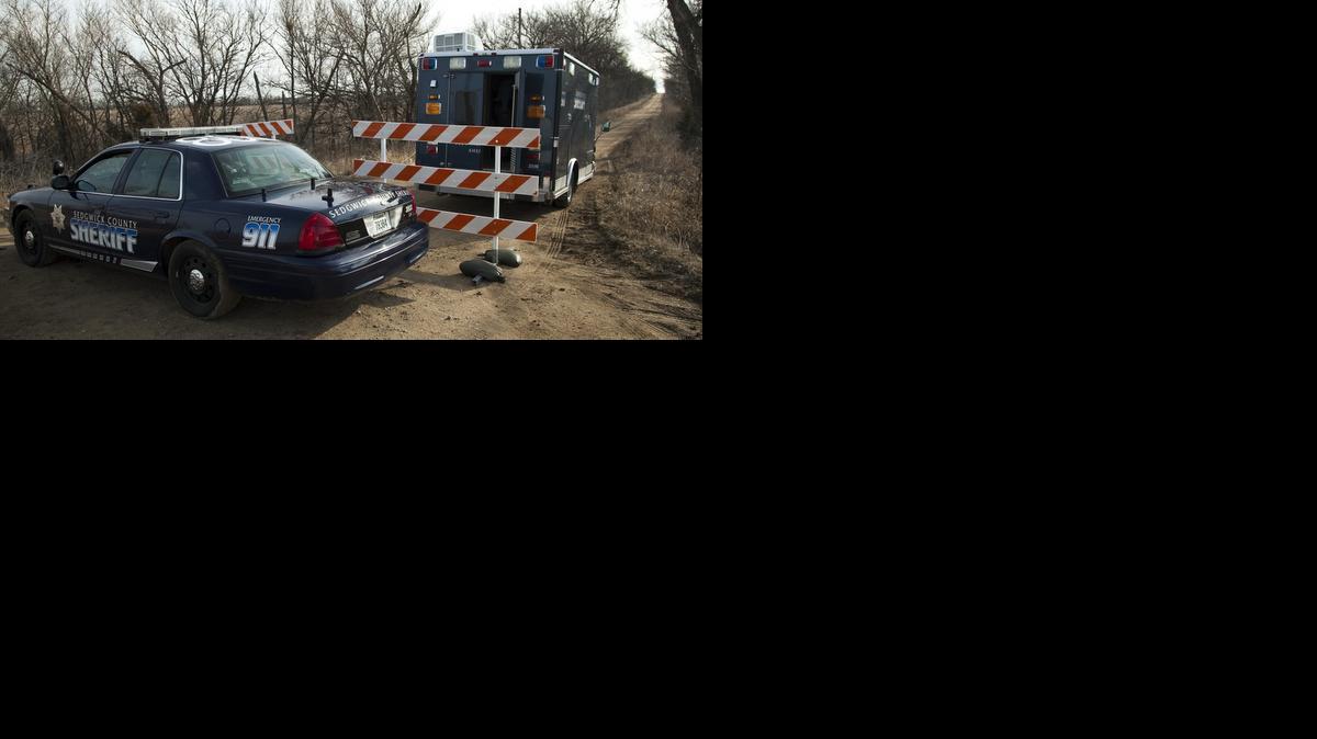 A Sedgwick County sheriff mobile command truck sits at the scene Tuesday morning on Northwest 70th Street, in Butler County, southeast of Potwin, following the Monday shooting of a Sedgwick County sheriff’s deputy and a male suspect following a traffic pursuit that ended in Butler County on Monday night. (March 12, 2013)

