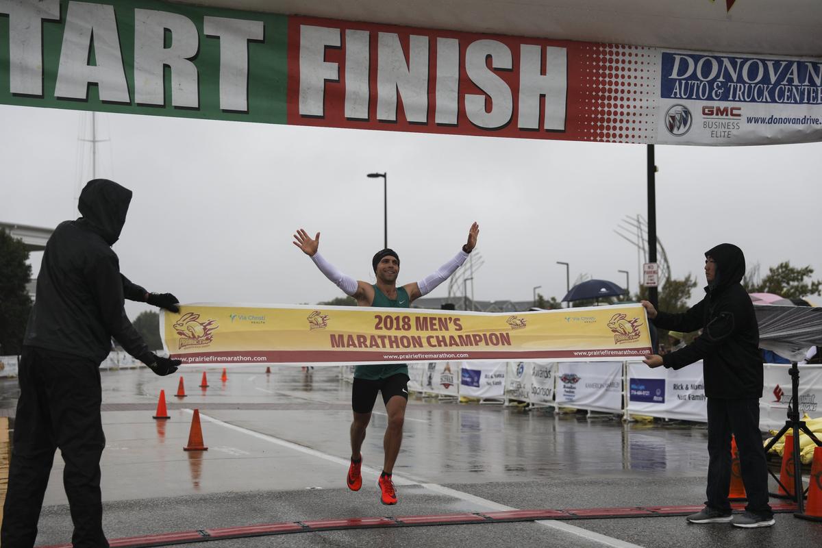 Men’s Prairie Fire Marathon winner Benjamin Kopecky crosses the finish line in 2018. Kopecky finished in 2:26:36.