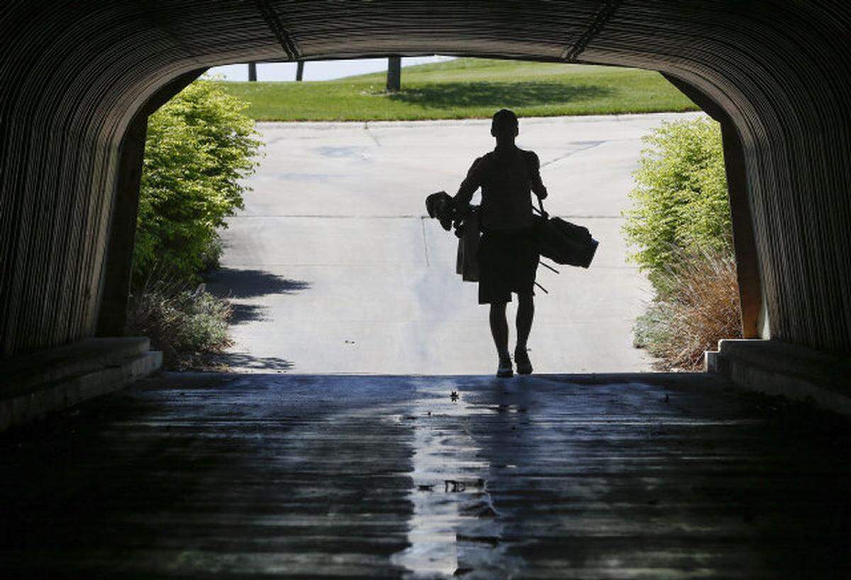 Kapaun Mount Carmel’s Matthew Gilbaugh walks to the first tee during the City League golf tournament at Auburn Hills on Wednesday. (May 7, 2013)
