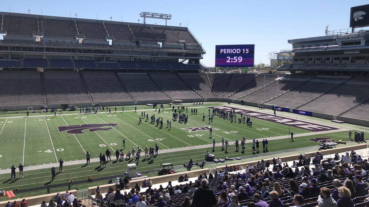 The Kansas State football team practices in front of fans at Bill Snyder Family Stadium.
