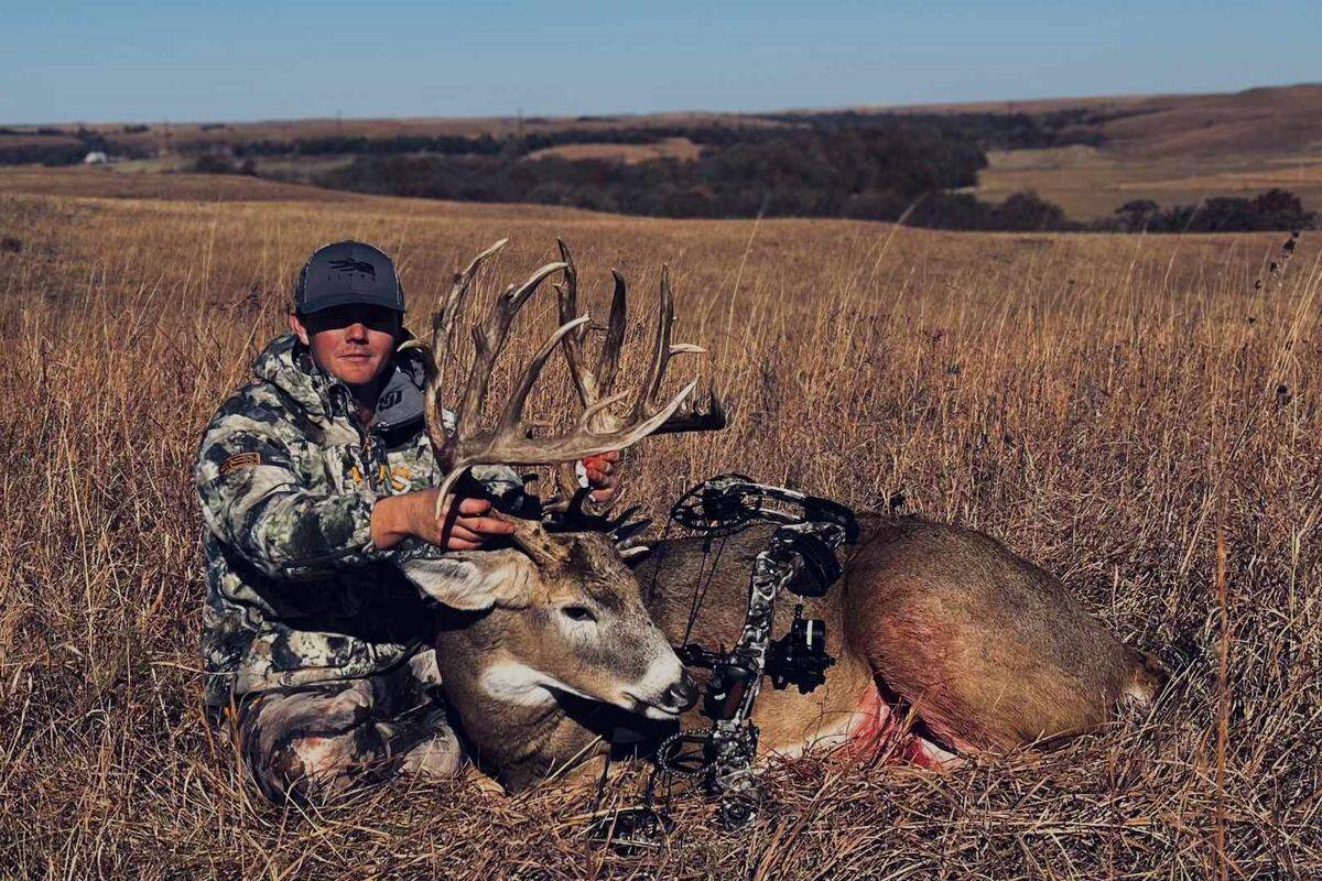 Chad Chambers poses with the deer he named Titus after shooting him on Oct. 27 on private land in Wabausee County, Kansas.