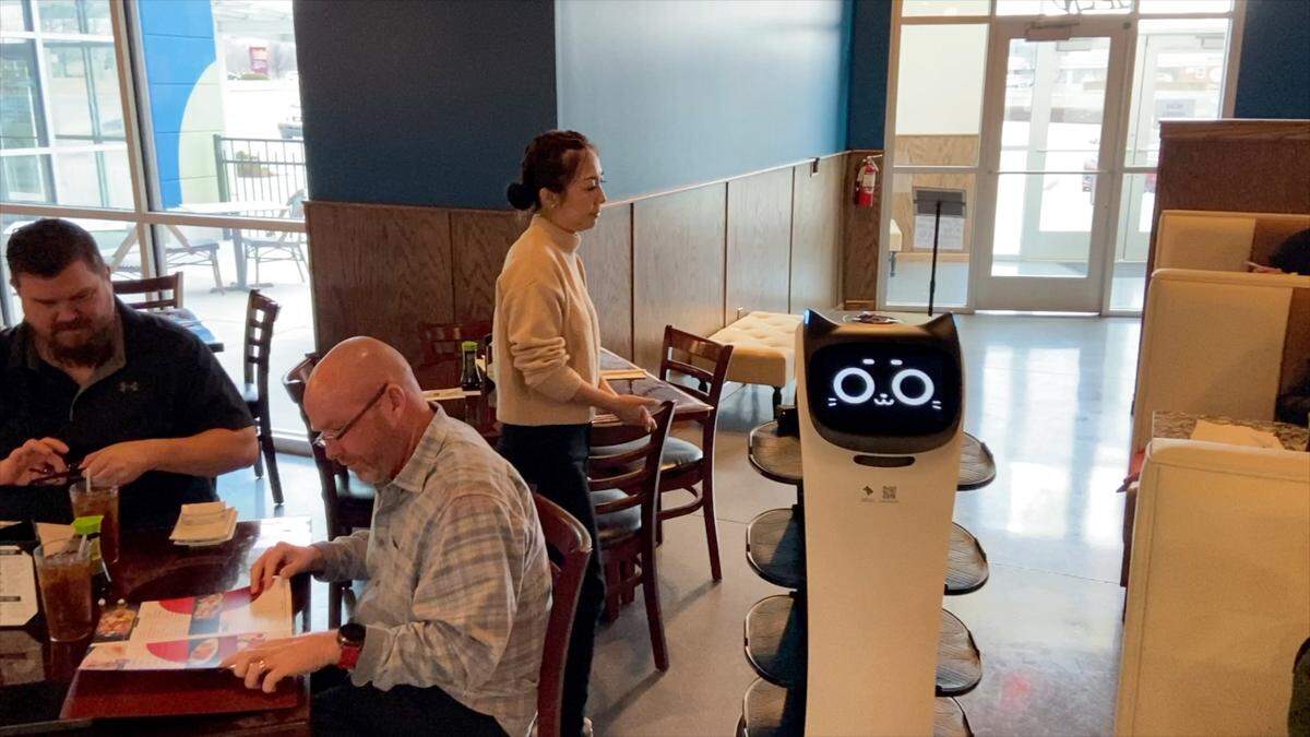 A robot makes its way back to the kitchen after delivering food at Ninza Sushi Bar’s new location at 13th and Tyler. The food usually is loaded and unloaded by the restaurant staff.