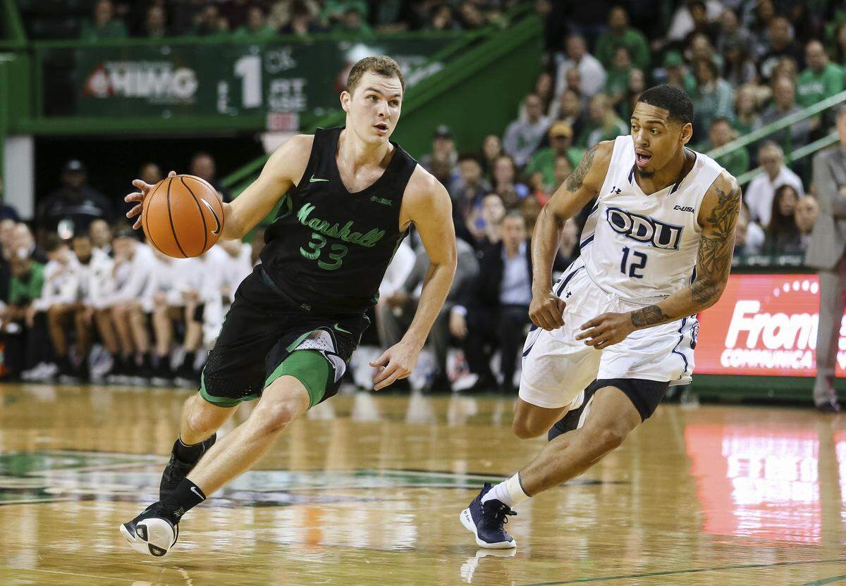 Marshall's Jon Elmore (33) pushes up the floor against Old Dominion's Randy Haynes (12) during a game in February in Huntington, W.Va.