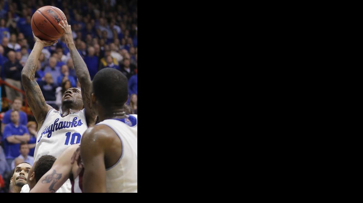 Kansas’ Naadir Tharpe his a shot against Oklahoma toward the end of their game against Oklahoma at Allen Fieldhouse on Monday night.

