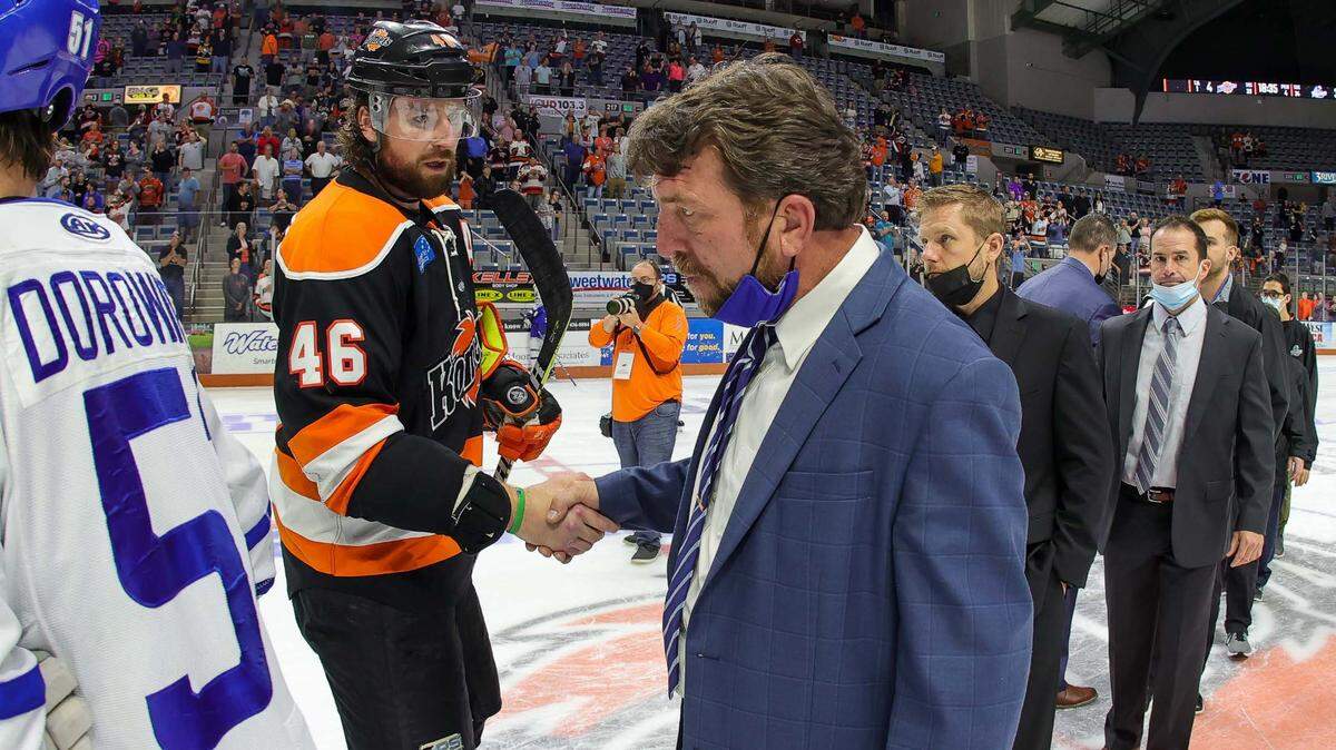 Wichita Thunder coach Bruce Ramsay congratulates a Fort Wayne Komet following his team’s 4-3 overtime loss to end Wichita’s season.