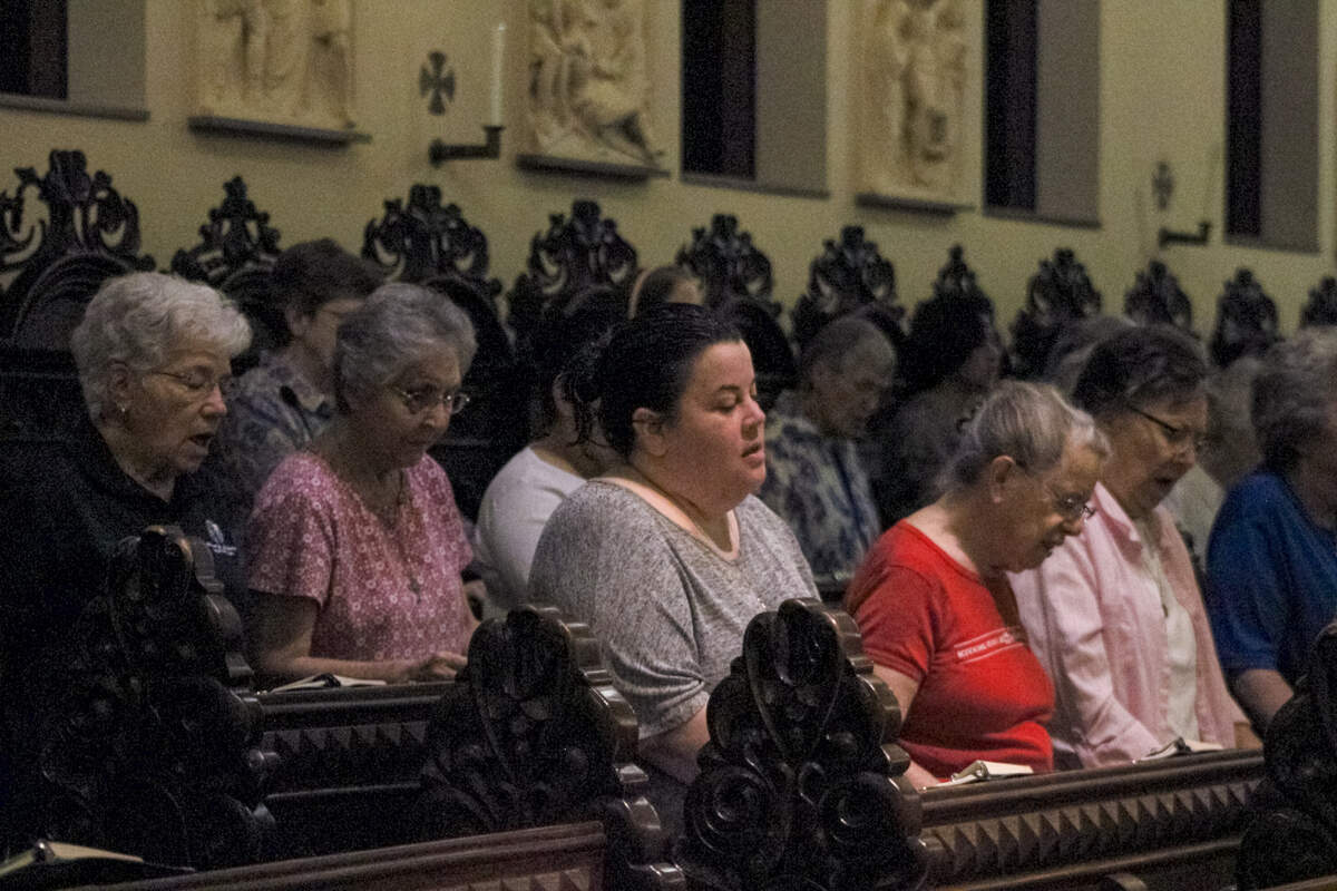 The Benedictine Sisters of Mount St. Scholastica gather for morning prayers in the monastery’s chapel.